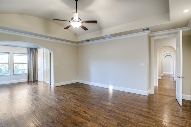 spare room featuring ceiling fan, lofted ceiling, dark hardwood / wood-style flooring, and ornamental molding