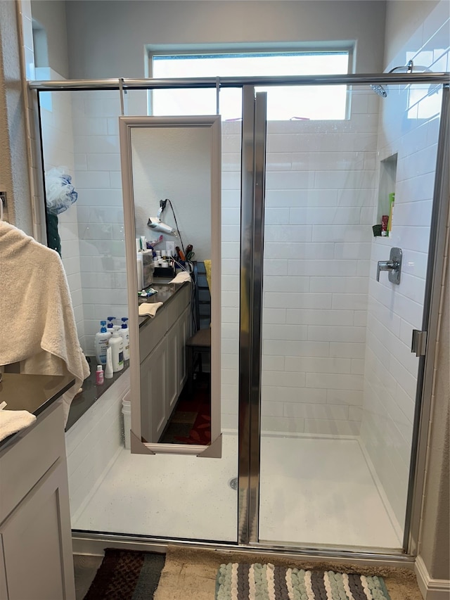 bathroom with vanity and walk in shower