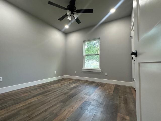 empty room featuring a ceiling fan, recessed lighting, baseboards, and dark wood finished floors