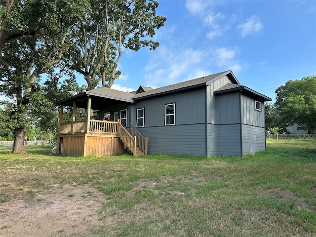 rear view of house with a lawn