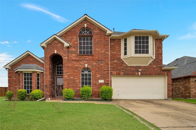 view of front property with a front lawn and a garage