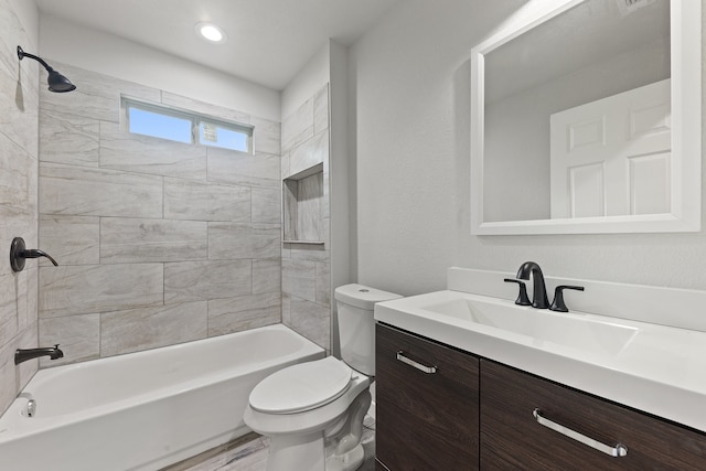 full bathroom with tiled shower / bath combo, vanity, toilet, and wood-type flooring