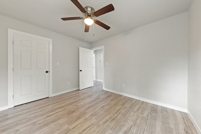 unfurnished bedroom with light hardwood / wood-style flooring and ceiling fan