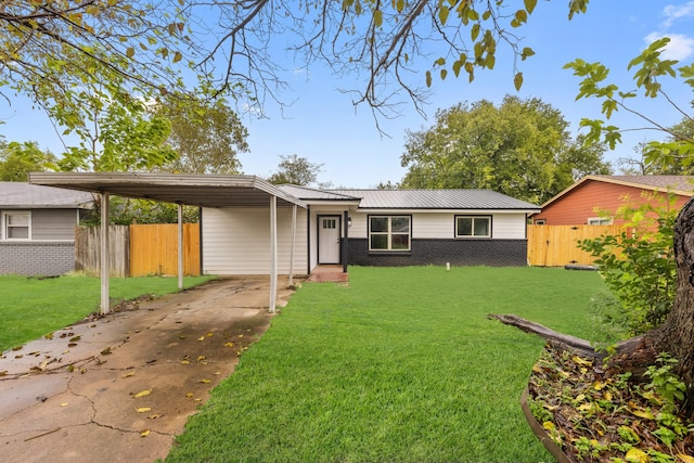 ranch-style home with a carport and a front yard