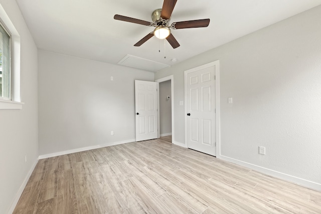 spare room featuring light hardwood / wood-style flooring and ceiling fan