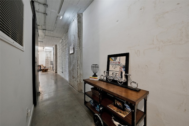 hallway with concrete floors