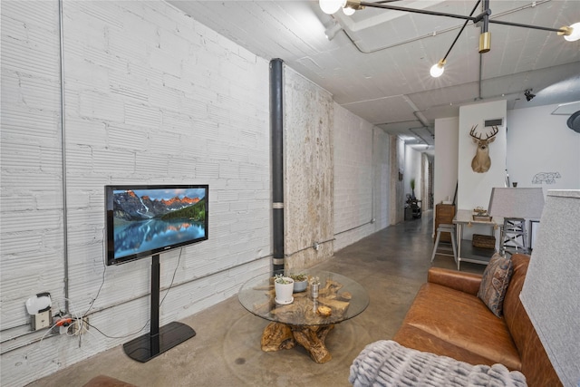 living room with concrete flooring