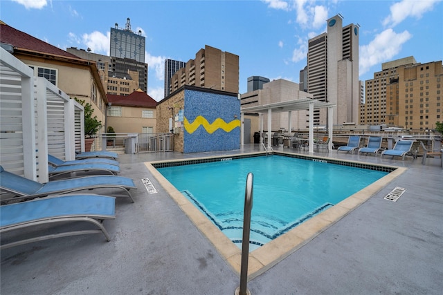 view of swimming pool with a patio