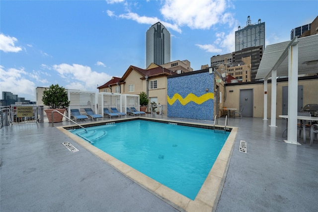 view of pool featuring a patio