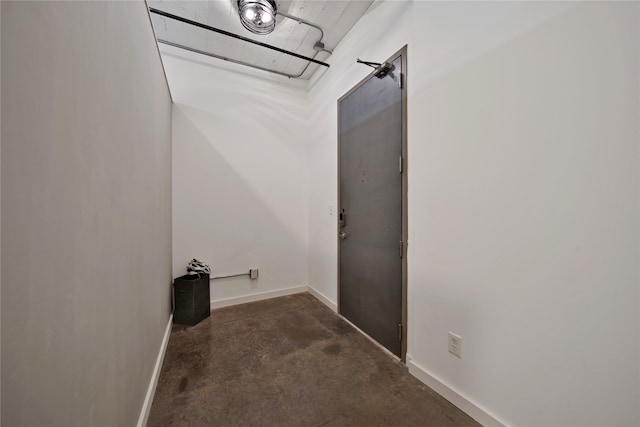 bathroom featuring concrete flooring