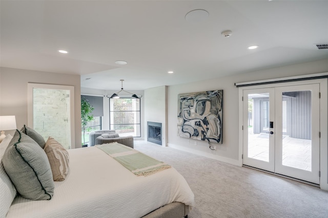 carpeted bedroom featuring access to outside and french doors