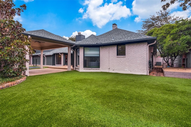 back of house featuring a patio area, a yard, and ceiling fan