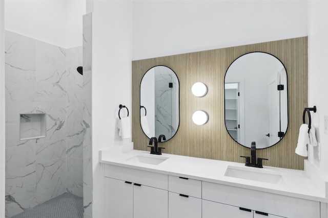 bathroom featuring vanity and a tile shower