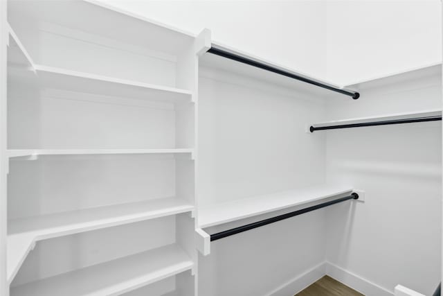 walk in closet featuring wood-type flooring