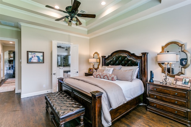 bedroom featuring ceiling fan, dark hardwood / wood-style floors, a raised ceiling, and crown molding