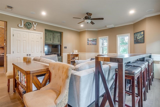 1645 County Road 1105, Rio Vista, TX 76093 - interior space with a ceiling fan, light wood finished floors, wainscoting, and visible vents