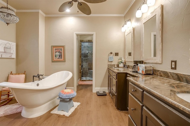 1645 County Road 1105, Rio Vista, TX 76093 - full bath with a sink, ceiling fan, a shower stall, wood finished floors, and two vanities