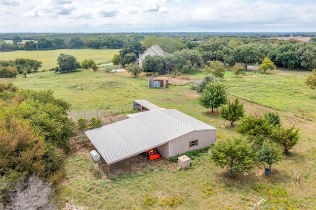 birds eye view of property with a rural view