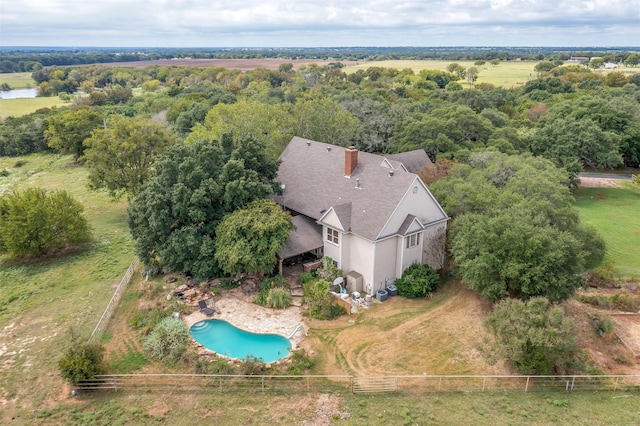 birds eye view of property with a rural view