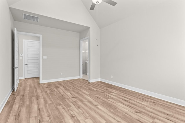 spare room with ceiling fan, high vaulted ceiling, and light wood-type flooring