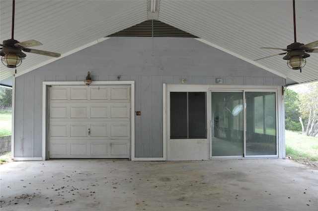 exterior space with a garage and ceiling fan