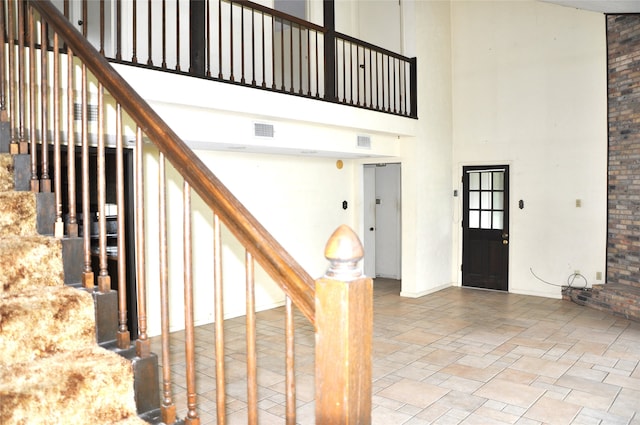 interior space with a towering ceiling