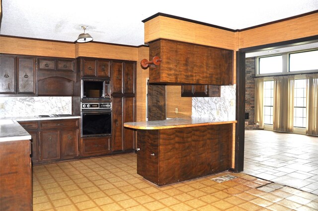 kitchen with black appliances, decorative backsplash, dark brown cabinetry, and a textured ceiling