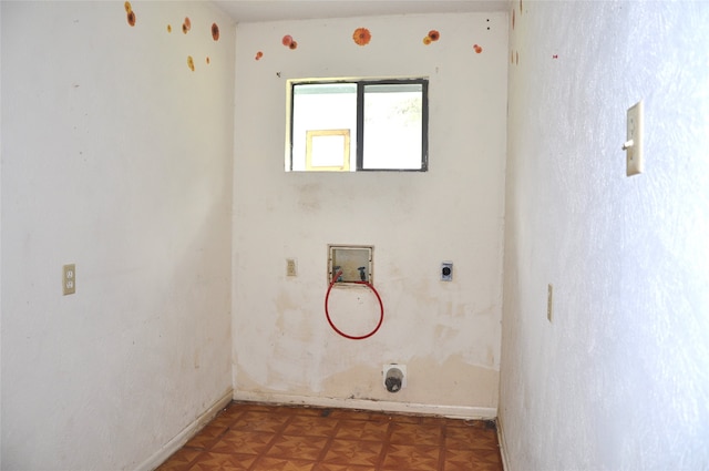 clothes washing area with hookup for a washing machine, parquet flooring, and hookup for an electric dryer