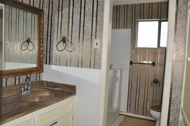 bathroom with vanity and toilet