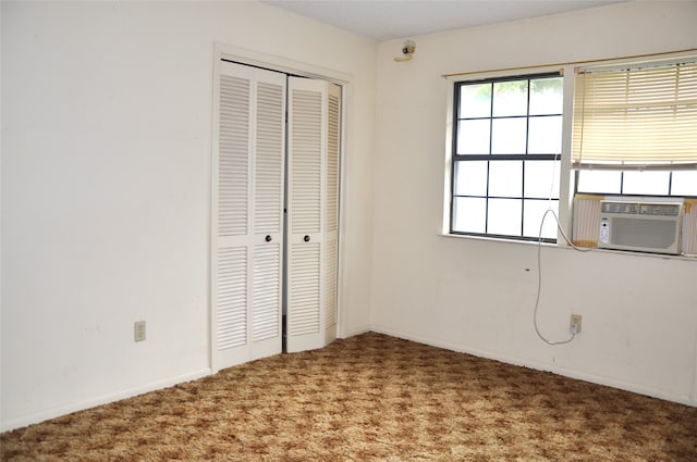 unfurnished bedroom featuring a closet and carpet floors