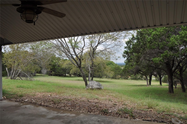 view of yard featuring a ceiling fan