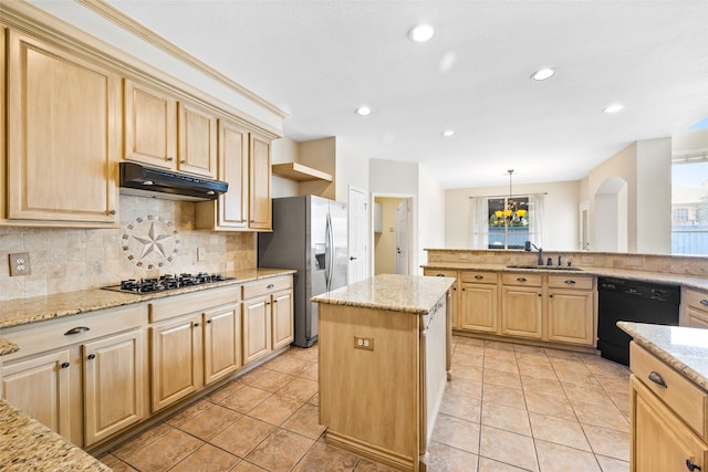 kitchen with a kitchen island, light stone countertops, light tile patterned floors, stainless steel appliances, and sink