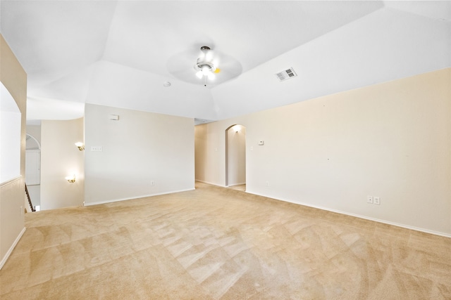 carpeted empty room with lofted ceiling and ceiling fan