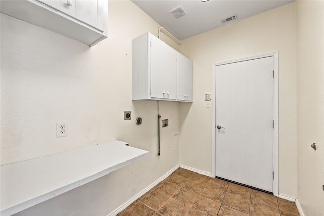 washroom featuring washer hookup, hookup for an electric dryer, and cabinets