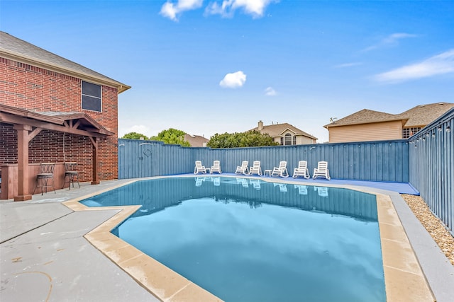 view of swimming pool featuring a patio area