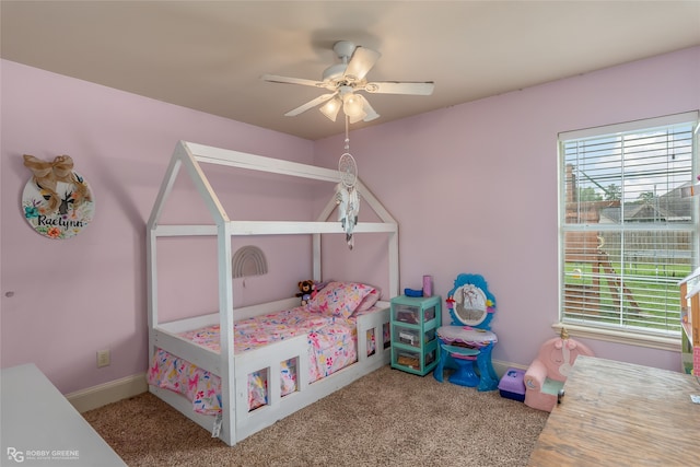 carpeted bedroom with ceiling fan