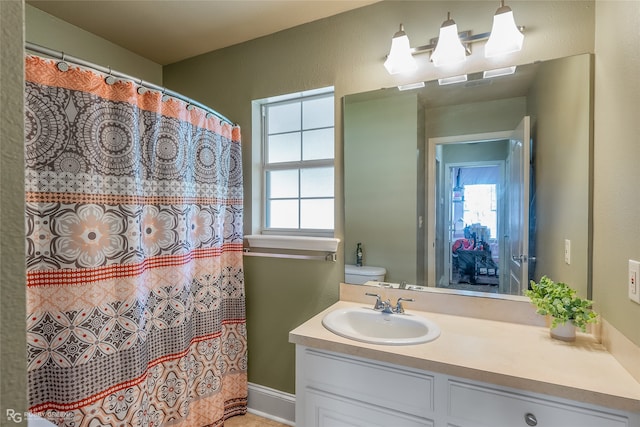 bathroom with vanity and toilet