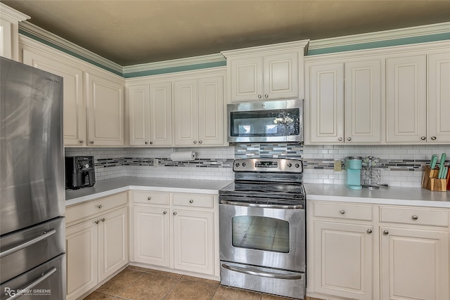 kitchen featuring crown molding, light tile patterned floors, stainless steel appliances, and decorative backsplash