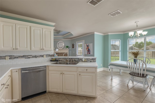 kitchen with light tile patterned floors, dishwasher, kitchen peninsula, an inviting chandelier, and sink