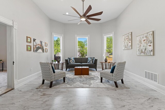 1401 Arp St, Commerce, TX 75428 - living room featuring marble tiled flooring, a ceiling fan, baseboards, and recessed lighting