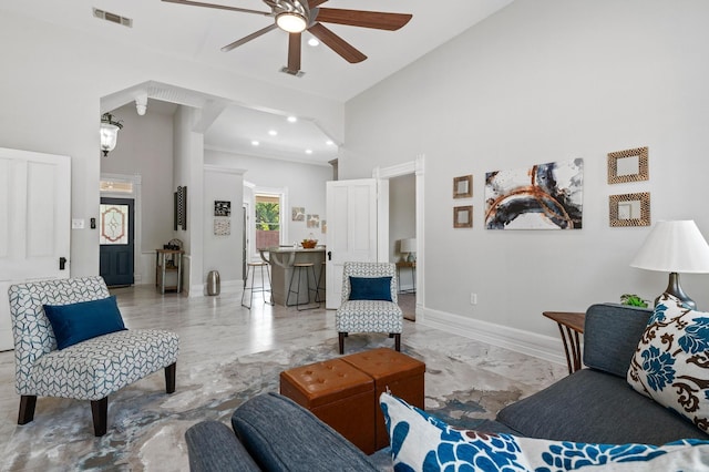 1401 Arp St, Commerce, TX 75428 - living room featuring marble look tile flooring, a ceiling fan, a towering ceiling, recessed lighting, and baseboards