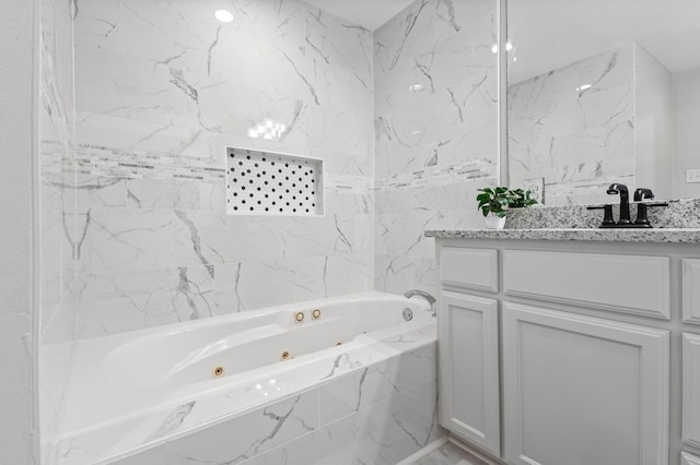 1401 Arp St, Commerce, TX 75428 - bathroom featuring a jetted tub and vanity