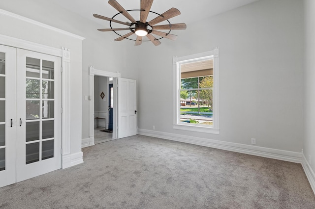 1401 Arp St, Commerce, TX 75428 - unfurnished bedroom featuring carpet flooring, french doors, baseboards, and a ceiling fan