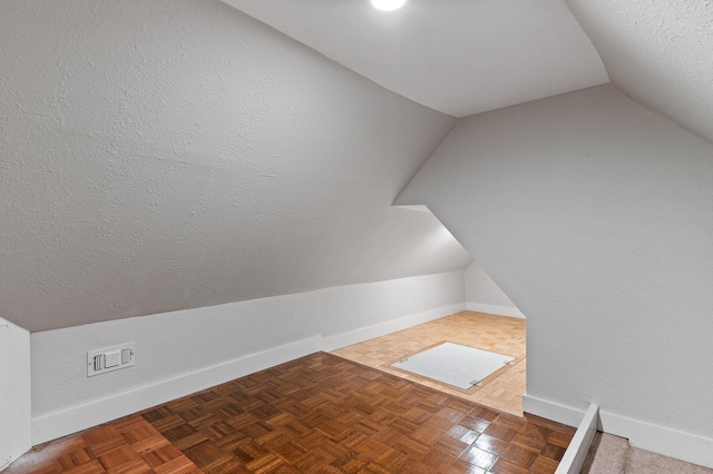 1401 Arp St, Commerce, TX 75428 - additional living space featuring lofted ceiling and baseboards