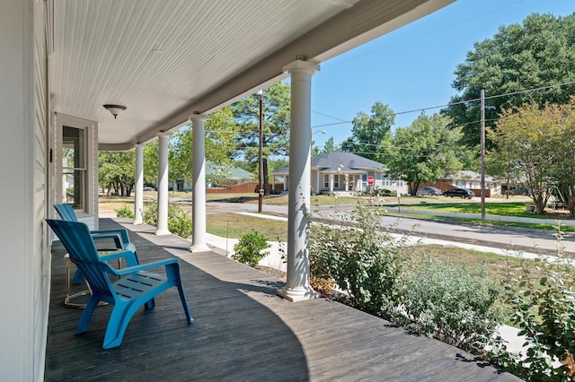 1401 Arp St, Commerce, TX 75428 - wooden terrace with a porch