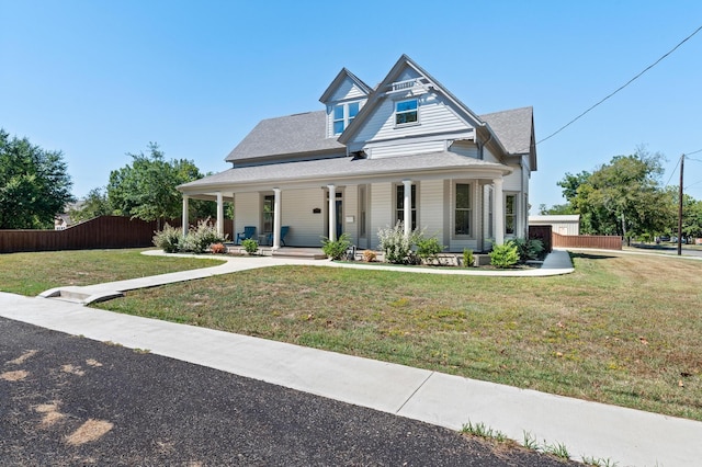 view of front of property featuring a front lawn and covered porch