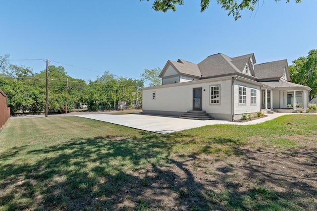 1401 Arp St, Commerce, TX 75428 - back of property featuring a yard