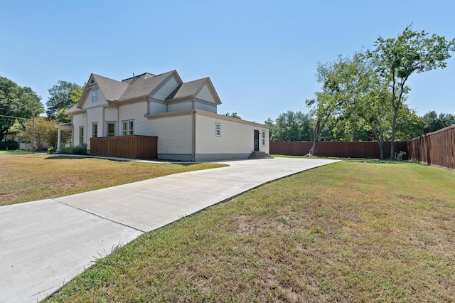 view of home's exterior featuring a lawn