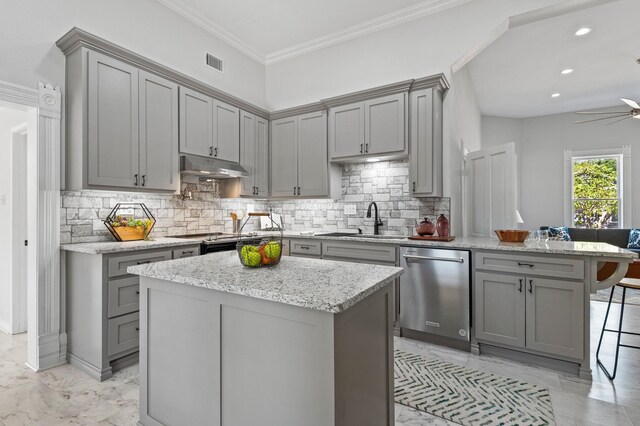 1401 Arp St, Commerce, TX 75428 - kitchen with gray cabinetry, dishwasher, a sink, under cabinet range hood, and light marble finish floors