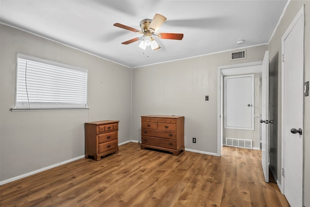 unfurnished bedroom with hardwood / wood-style floors and ceiling fan